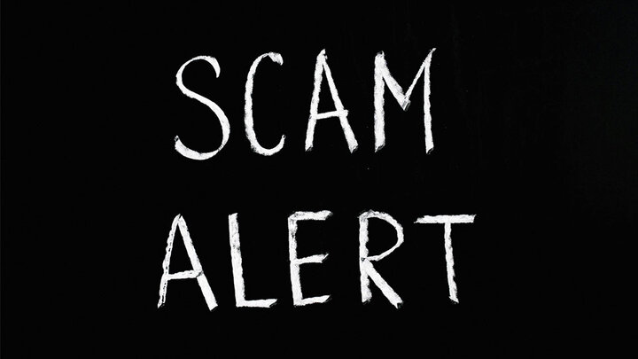 Scam Alert lettering text on black background